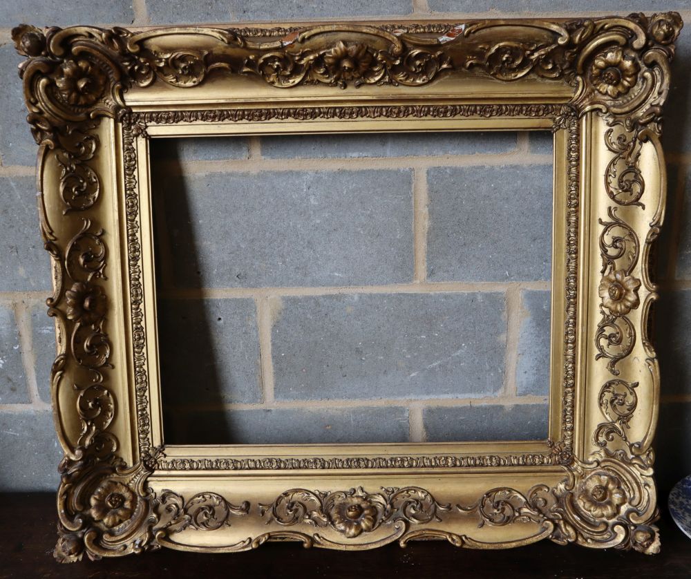 A Victorian carved giltwood and gesso picture frame, width 101cm height 87cm, aperture width 68 x 54cm